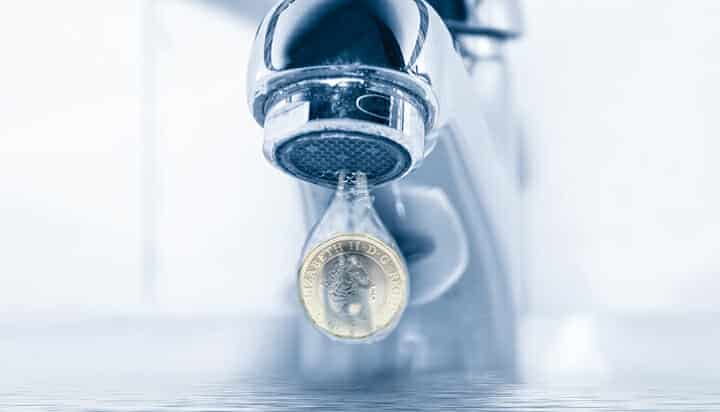 Picture of a tap with a pound coin.