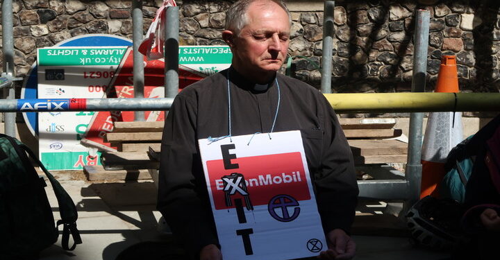 Clergy glue to church furniture to protest over holy fossil fuel bonds